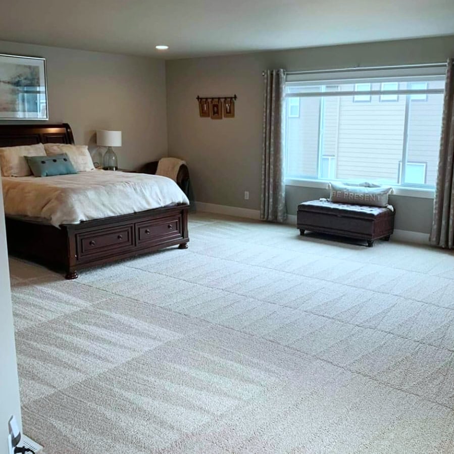 Bright and inviting bedroom with freshly cleaned carpet, highlighting Cyclone Cleaning & Janitorial&rsquo;s attention to detail in residential cleaning.