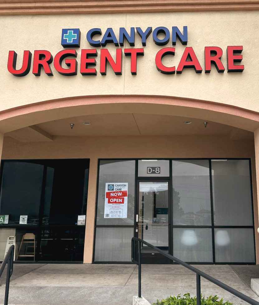 Exterior of Canyon Urgent Care in Canyon Country, Santa Clarita, with a &ldquo;Now Open&rdquo; sign on the door.