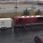 The "Mobile Studio USA" trailer is seen attached to a large maroon tour bus belonging to the band Pentatonix, parked in a lot. The trailer setup indicates it&rsquo;s ready to support audio recording needs on the road.