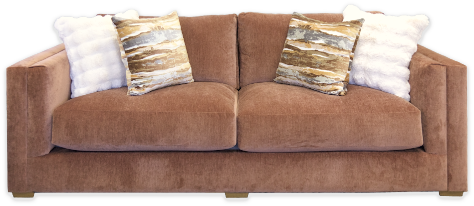 Plush rust red custom sofa adorned with patterned pillows, designed to reflect your style and attitude.