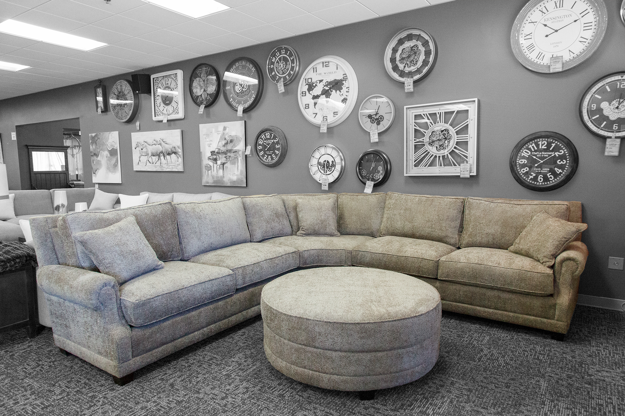 Large boucle gray fabric section with matching round ottoman. 