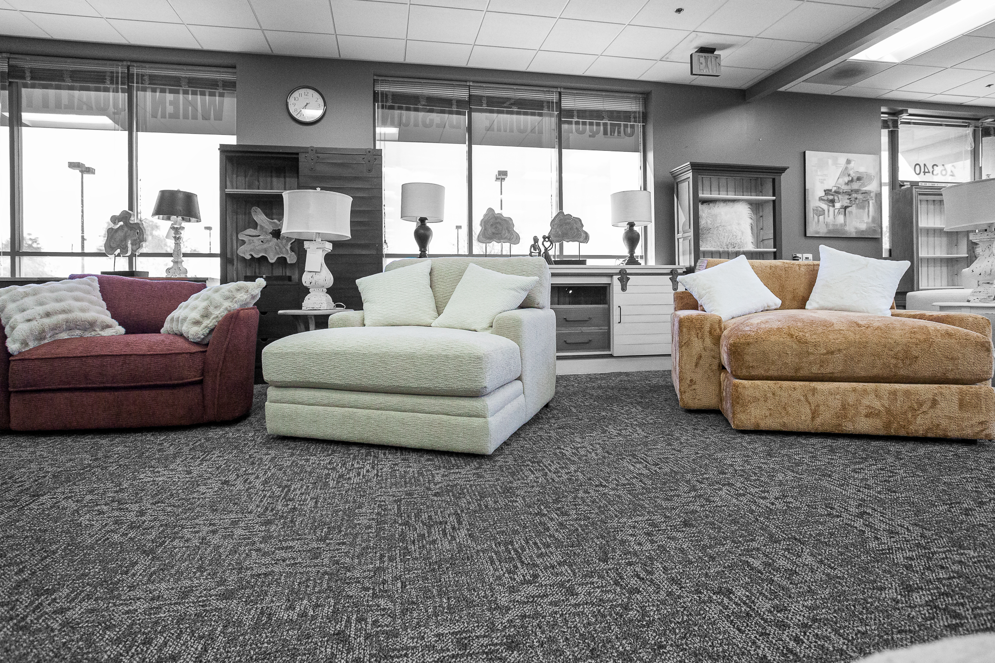 Three custom-made upholstered chairs in red, cream, and camel fabric, displayed in a Santa Clarita furniture showroom.